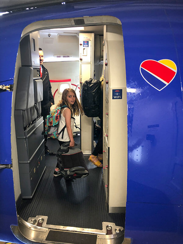 A young child boarding a Southwest flight